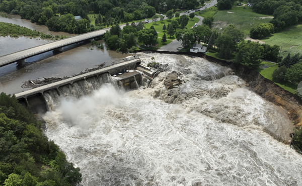 Midwest flooding rages on; collapses bridge, threatens dam