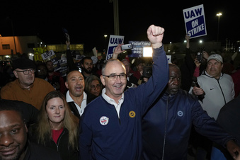 Workers strike at all 3 Detroit automakers in a battle for a bigger share of industry profits