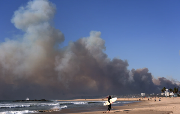 30,000 Los Angeles residents flee from wind-fueled fires