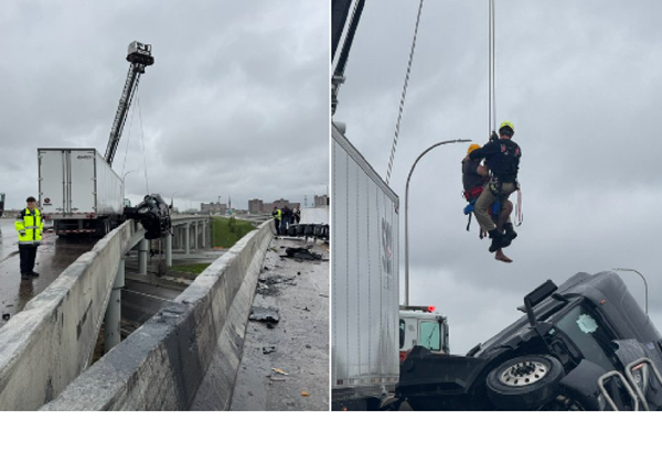Semi driver rescued from cab dangling from Louisville overpass