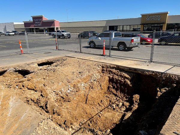 Stormwater pipe collapses in parking lot off James-Sanders Blvd.